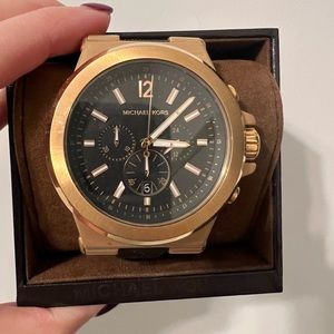 Rose gold men’s Michael kors watch. Black rubber wrist.